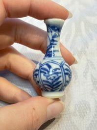 A group of 12 Chinese blue and white miniature vases and a small bottle vase, Kangxi