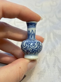 A group of 12 Chinese blue and white miniature vases and a small bottle vase, Kangxi