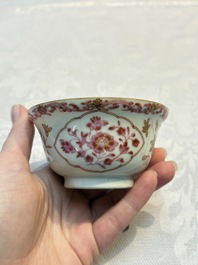 A pair of Chinese famille rose gilt-decorated covered cups and saucers and an openworked cup, Qianlong