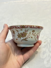 A pair of Chinese famille rose gilt-decorated covered cups and saucers and an openworked cup, Qianlong