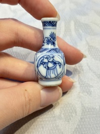 A group of 12 Chinese blue and white miniature vases and a small bottle vase, Kangxi