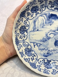 A very fine Chinese blue and white plate with a scholar in a landscape, Kangxi mark and of the period