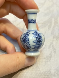 A group of 12 Chinese blue and white miniature vases and a small bottle vase, Kangxi