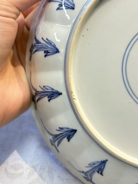 A very fine Chinese blue and white plate with a scholar in a landscape, Kangxi mark and of the period