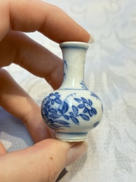 A group of 12 Chinese blue and white miniature vases and a small bottle vase, Kangxi