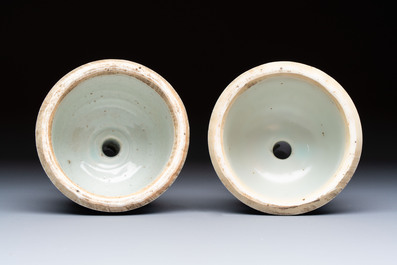 A pair of Chinese blue and white 'Dragons Chasing the Flaming Pearl&rsquo; candlesticks, 19th C.