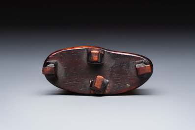 A Chinese carved mother-of-pearl figure of an official on wooden stand, 18/19th C.
