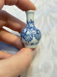 A group of 12 Chinese blue and white miniature vases and a small bottle vase, Kangxi