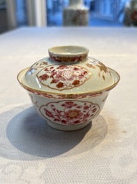 A pair of Chinese famille rose gilt-decorated covered cups and saucers and an openworked cup, Qianlong