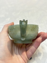 A Chinese celadon jade covered vase, with wooden stand, and a bowl with wooden cover and stand, 19/20th C.