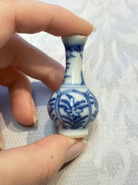 A group of 12 Chinese blue and white miniature vases and a small bottle vase, Kangxi