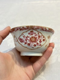 A pair of Chinese famille rose gilt-decorated covered cups and saucers and an openworked cup, Qianlong