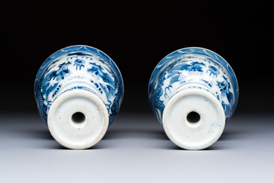A pair of Chinese blue and white 'Dragons Chasing the Flaming Pearl&rsquo; candlesticks, 19th C.