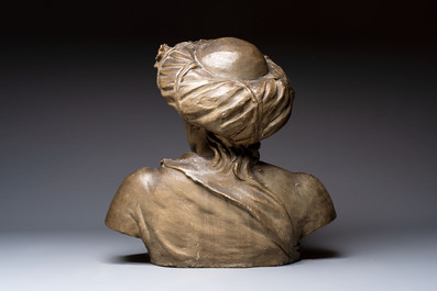 A large patinated terracotta bust of a smiling Oriental man, 18/19th C.