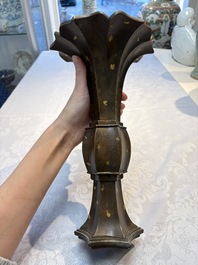 A Chinese gold-splashed bronze 'Gu' vase, Xuande mark, 17/18th C.