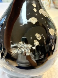 A Chinese black-glazed reverse-decorated bottle vase, 20th C.