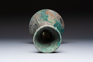 A Chinese archaic bronze wine vessel with Taotie design, Gu 觚, Shang