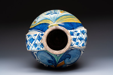 An unusual large polychrome Italian maiolica two-handled 'Cupid and Psyche' wet drug jar inscribed 'Rodomel', probably Rome, early 16th C.
