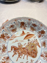 A Chinese iron-red and gilt-decorated dish with a courtly carriage scene, Kangxi