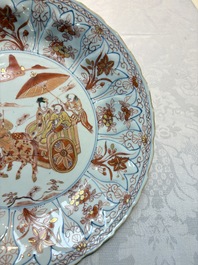 A Chinese iron-red and gilt-decorated dish with a courtly carriage scene, Kangxi