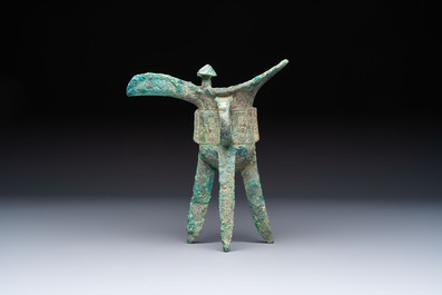 A Chinese archaic bronze wine vessel with Taotie design, Jue 爵, late Shang