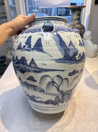 A Chinese blue and white 'Mountainous Landscape' vase with four lion-form handles, 16/17th C.