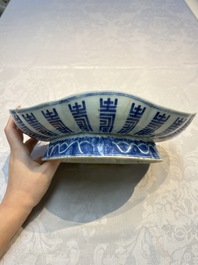 Four Chinese blue, white and famille rose tazzas and a covered spice bowl with bats design, 19th C.