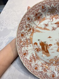 A Chinese iron-red and gilt-decorated dish with a garden scene, Kangxi