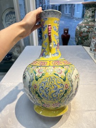 A Chinese famille rose yellow-ground &lsquo;Bats and Peaches&rsquo; bottle vase, Jiaqing/Daoguang