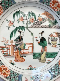 A pair of Chinese famille verte 'Ladies in a Garden' plates, Kangxi