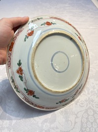 A pair of Chinese famille verte 'Ladies in a Garden' plates, Kangxi