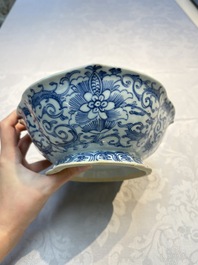 Four Chinese blue, white and famille rose tazzas and a covered spice bowl with bats design, 19th C.