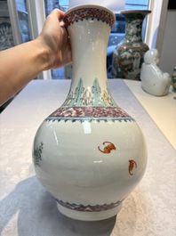 A Chinese famille rose vase with floral design, Hongxian mark and of the period