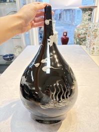 A Chinese black-glazed reverse-decorated bottle vase, 20th C.