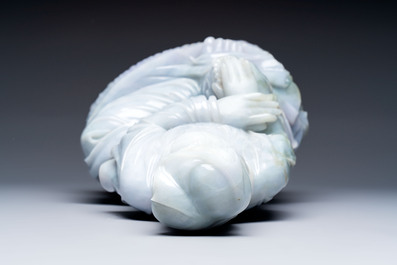 An exceptional and large Chinese carved pale lavender jadeite Guanyin on a wooden stand, Republic