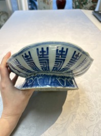 Four Chinese blue, white and famille rose tazzas and a covered spice bowl with bats design, 19th C.