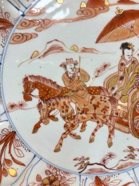 A Chinese iron-red and gilt-decorated dish with a courtly carriage scene, Kangxi