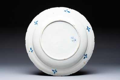 A pair of blue and white Dutch Delft 'Cranes' plates and a dish, 18th C.