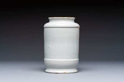 A blue and white Dutch Delft tobacco jar and a drug jar with brass lids, 18th C.
