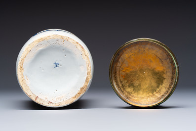 A blue and white Dutch Delft tobacco jar and a drug jar with brass lids, 18th C.