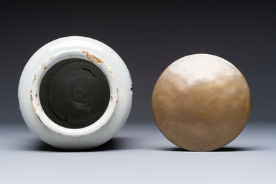 A blue and white Dutch Delft tobacco jar and a drug jar with brass lids, 18th C.