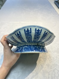 Four Chinese blue, white and famille rose tazzas and a covered spice bowl with bats design, 19th C.