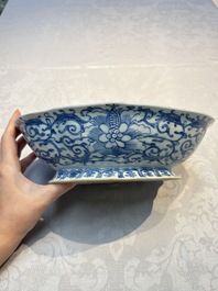 Four Chinese blue, white and famille rose tazzas and a covered spice bowl with bats design, 19th C.