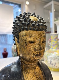 A large Chinese gilt-lacquered bronze Buddha, 17th C.