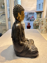 A large Chinese gilt-lacquered bronze Buddha, 17th C.