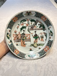 A pair of Chinese famille verte 'Ladies in a Garden' plates, Kangxi