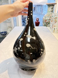 A Chinese black-glazed reverse-decorated bottle vase, 20th C.