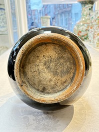 A Chinese black-glazed reverse-decorated bottle vase, 20th C.
