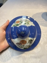 Two Chinese famille verte blue-ground vases and covers, 19th C.