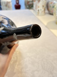A Chinese black-glazed reverse-decorated bottle vase, 20th C.